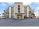 Well-maintained condo building exterior with covered entrance and ample parking at 2626 S Atlantic Ave # 102, Daytona Beach Shores, FL 32118