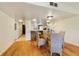 Dining area with a round glass table and woven chairs near kitchen bar with seating at 2626 S Atlantic Ave # 102, Daytona Beach Shores, FL 32118