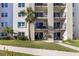 Attractive condo exterior featuring multiple balconies and manicured green space at 2626 S Atlantic Ave # 102, Daytona Beach Shores, FL 32118