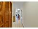 Hallway with tile floor and a view through to the living room at 2626 S Atlantic Ave # 102, Daytona Beach Shores, FL 32118