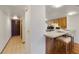 Kitchen with breakfast bar and stools plus laminate floors at 2626 S Atlantic Ave # 102, Daytona Beach Shores, FL 32118