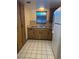 Kitchen with double sink and wood cabinets at 2626 S Atlantic Ave # 102, Daytona Beach Shores, FL 32118