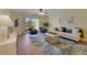Cozy living room with plush seating, area rug, and natural light at 2626 S Atlantic Ave # 102, Daytona Beach Shores, FL 32118