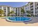 Inviting kidney-shaped swimming pool with surrounding patio furniture at 2626 S Atlantic Ave # 102, Daytona Beach Shores, FL 32118