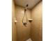 Clean shower with tile surround and handheld shower head at 2626 S Atlantic Ave # 102, Daytona Beach Shores, FL 32118