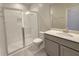Modern bathroom featuring a glass-enclosed shower and a vanity sink at 2678 Great Heron Ave, St Cloud, FL 34773