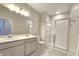 Bathroom features double sinks, a glass-enclosed shower, and ample counter space at 2678 Great Heron Ave, St Cloud, FL 34773