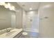 Well-lit bathroom features a bathtub/shower combination with modern fixtures and a clean design at 2678 Great Heron Ave, St Cloud, FL 34773