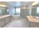 Spa-like bathroom with dual vanities, soaking tub, and a frameless glass shower at 2678 Great Heron Ave, St Cloud, FL 34773