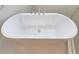 A close-up of a luxurious white bathtub at 2678 Great Heron Ave, St Cloud, FL 34773