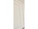 A crisp, white door with classic paneling and brushed nickel hardware presents a clean and inviting entry point at 2678 Great Heron Ave, St Cloud, FL 34773