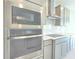 Modern kitchen featuring stainless steel appliances, stylish cabinetry, and sleek countertops at 2678 Great Heron Ave, St Cloud, FL 34773