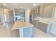 Bright kitchen features an island, stainless appliances, and sleek countertops at 2678 Great Heron Ave, St Cloud, FL 34773