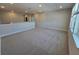 A large and inviting living room featuring soft carpeting and natural light at 2678 Great Heron Ave, St Cloud, FL 34773