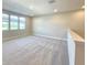 Cozy living room space boasting neutral walls, carpet flooring, and large windows at 2678 Great Heron Ave, St Cloud, FL 34773