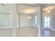 Bright living room with an open concept, neutral walls, decorative lighting and tile floors create a harmonious space at 2678 Great Heron Ave, St Cloud, FL 34773