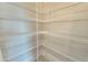 Well-organized pantry equipped with wire shelving to maximize space and ensure easy access to all your essentials at 2678 Great Heron Ave, St Cloud, FL 34773