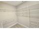 A well-organized walk-in closet with wire shelving for ample storage at 2678 Great Heron Ave, St Cloud, FL 34773