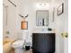 Clean bathroom with dark vanity, a toilet and bathtub at 2735 Calabria N Ave, Davenport, FL 33897