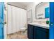 Bathroom with shower/tub combo and blue vanity at 2735 Calabria N Ave, Davenport, FL 33897