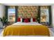 King bed with tropical-themed wallpaper at 2735 Calabria N Ave, Davenport, FL 33897