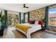 King-size bed, balcony access, and stylish decor at 2735 Calabria N Ave, Davenport, FL 33897