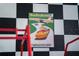 Bedroom with race car theme, checkered walls, and artwork at 2735 Calabria N Ave, Davenport, FL 33897