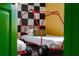 Race car themed bedroom with red beds and checkered walls at 2735 Calabria N Ave, Davenport, FL 33897