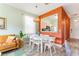 Open concept dining area with white table and chairs at 2735 Calabria N Ave, Davenport, FL 33897