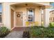 Inviting front porch with seating and landscaping at 2735 Calabria N Ave, Davenport, FL 33897