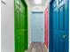 Hallway with colorful doors and wood flooring at 2735 Calabria N Ave, Davenport, FL 33897