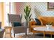 Chic living room features mustard sofa, patterned armchairs, and a marble coffee table at 2735 Calabria N Ave, Davenport, FL 33897