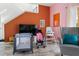 Living room featuring a TV, baby items, and comfortable seating at 2735 Calabria N Ave, Davenport, FL 33897