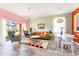 Open concept living and dining area with retro decor at 2735 Calabria N Ave, Davenport, FL 33897