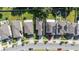 Aerial view of houses with solar panels and a tree-lined street at 2775 Red Horse Dr, Kissimmee, FL 34744