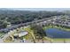Aerial view showing home's location near pool and lake at 2775 Red Horse Dr, Kissimmee, FL 34744