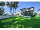 Large backyard with grassy area and screened patio at 2775 Red Horse Dr, Kissimmee, FL 34744