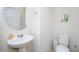 Powder room with pedestal sink and toilet at 2775 Red Horse Dr, Kissimmee, FL 34744