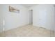 Bedroom with tile flooring and access to hallway at 2775 Red Horse Dr, Kissimmee, FL 34744