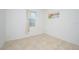 Simple bedroom with tile flooring and neutral decor at 2775 Red Horse Dr, Kissimmee, FL 34744
