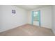 Simple bedroom with carpeted floors and window at 2775 Red Horse Dr, Kissimmee, FL 34744