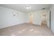 Spacious bedroom with carpet flooring and access to bathroom and hallway at 2775 Red Horse Dr, Kissimmee, FL 34744