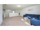 Large bonus room with a comfy sectional sofa at 2775 Red Horse Dr, Kissimmee, FL 34744