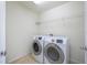 Laundry room with washer, dryer, and shelving at 2775 Red Horse Dr, Kissimmee, FL 34744