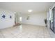 Spacious living room featuring tile flooring and access to backyard at 2775 Red Horse Dr, Kissimmee, FL 34744