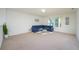 Living room with a comfy sectional sofa and carpet flooring at 2775 Red Horse Dr, Kissimmee, FL 34744