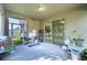 Covered patio with sliding door access to the home at 2775 Red Horse Dr, Kissimmee, FL 34744