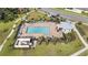 Community pool with lounge chairs and cabana at 2775 Red Horse Dr, Kissimmee, FL 34744