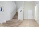 Staircase with beige carpet and white walls at 2775 Red Horse Dr, Kissimmee, FL 34744