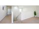 Upstairs hallway with carpet and access to bedrooms at 2775 Red Horse Dr, Kissimmee, FL 34744